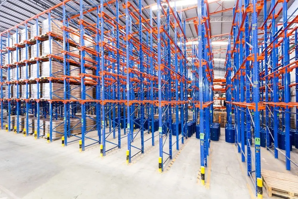 Rows of blue and orange pallet racking in a warehouse